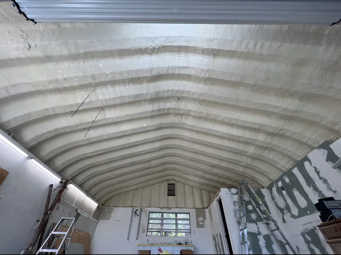 Spray polyurethane foam applied to the underside of a metal roof deck in Allendale